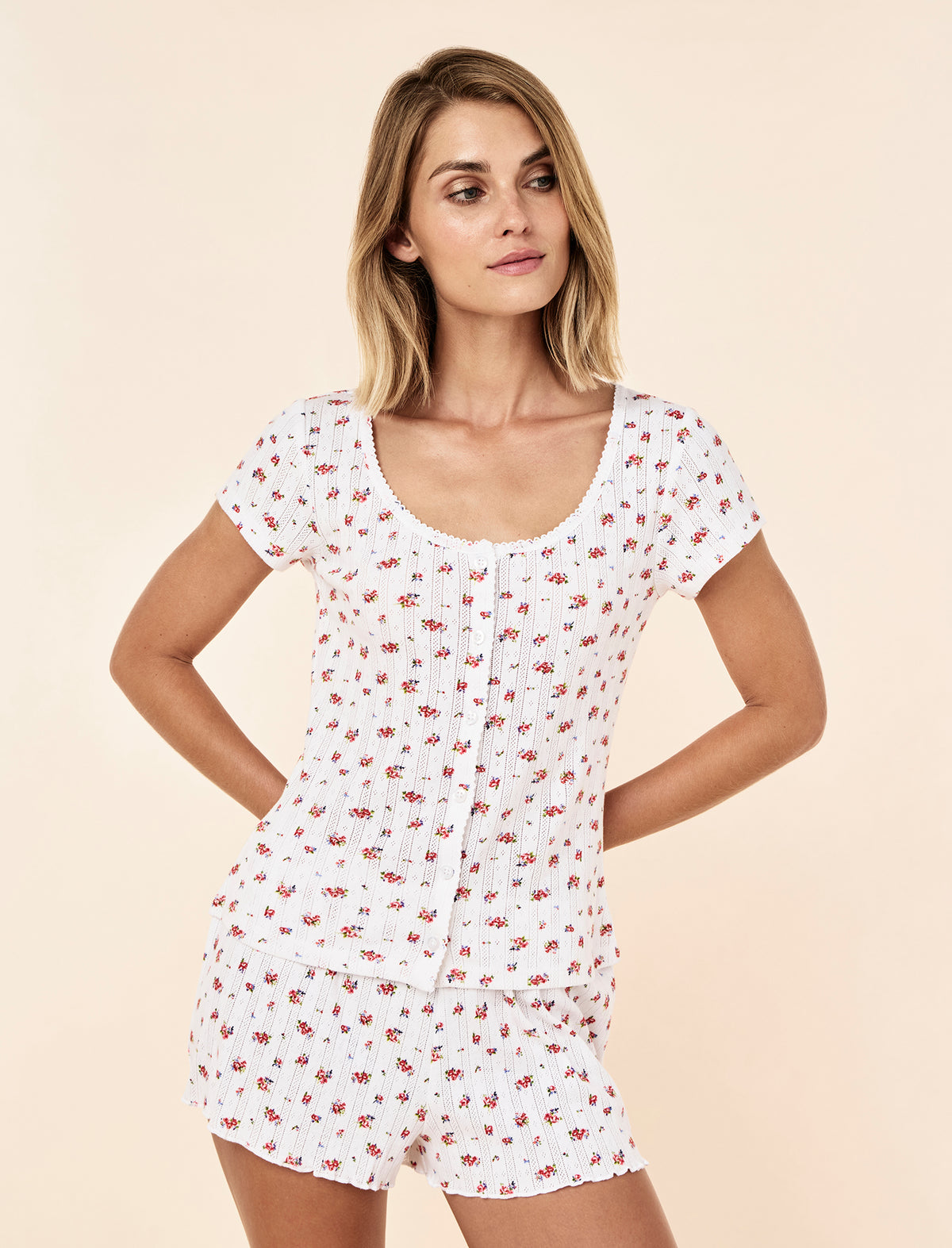 Lilly wearing the Imogen Pointelle Tee
[model: Lilly wears size S |  Height: 170cm
/ 5’7” | Bust: 75cm | Waist: 58cm | Hips: 89cm]
