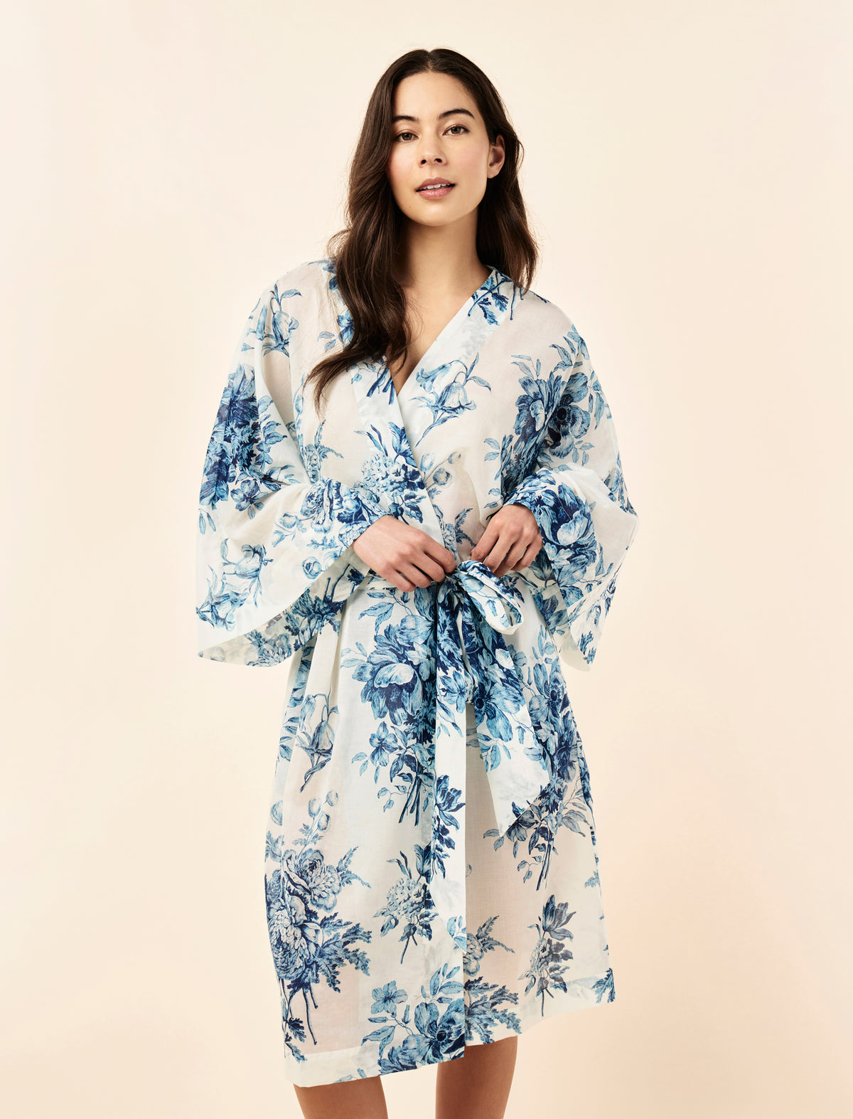 Sakura wearing the Karen Walker Romantic Floral Midi Wide Sleeve Robe